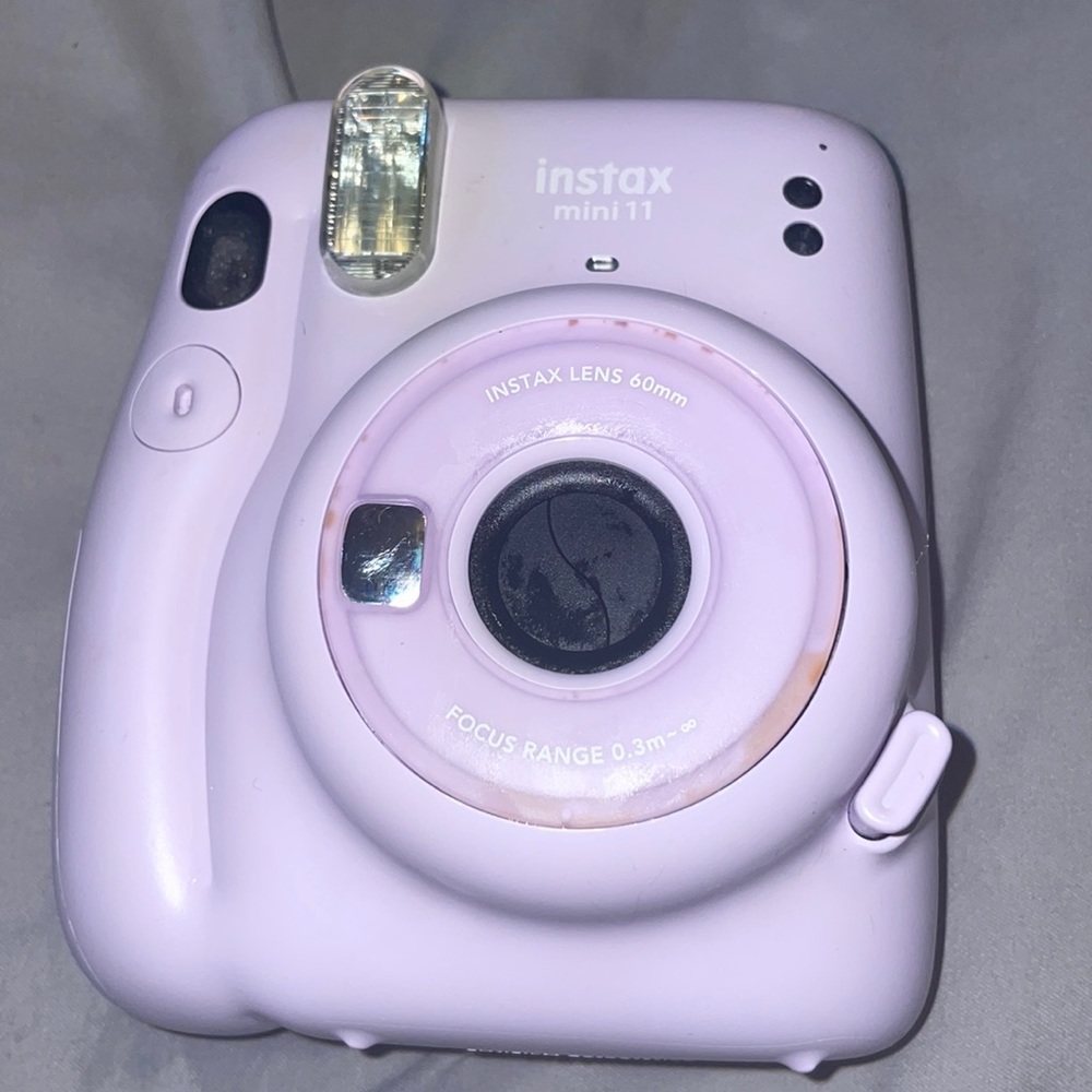 Purple instax mini Polaroid camera